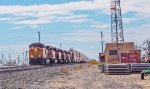 BNSF 4100 leads eastbound stacks past the ex-ATSF depot in Pampa, TX